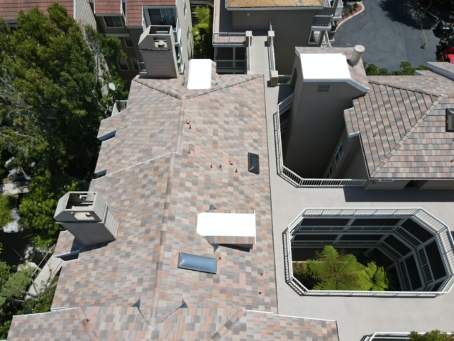 Residential roof with brown shingles