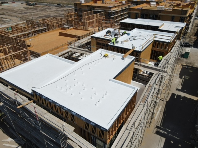 Aerial view of commercial flat roof installation